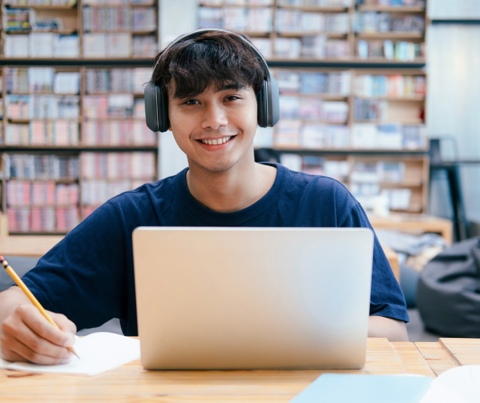 Image of a male student with a laptop